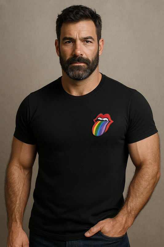 Gay masculine beared man wearing a black t-shirt with a Rainbow Rolling Stones style Embroidery on the heart